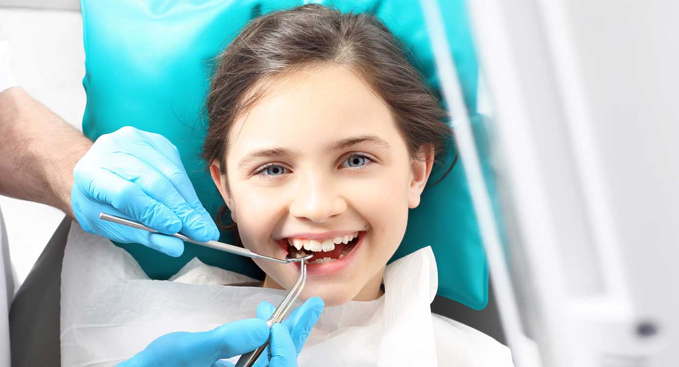 Happy Child Patient with Dentist