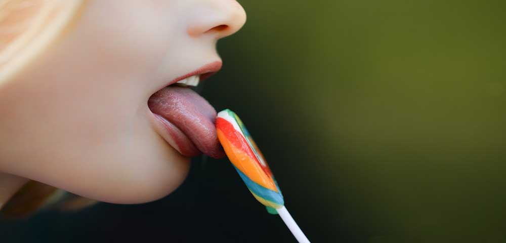 Girl is Licking a Lolipop